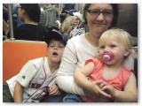 My family snuggle up on the subway.
